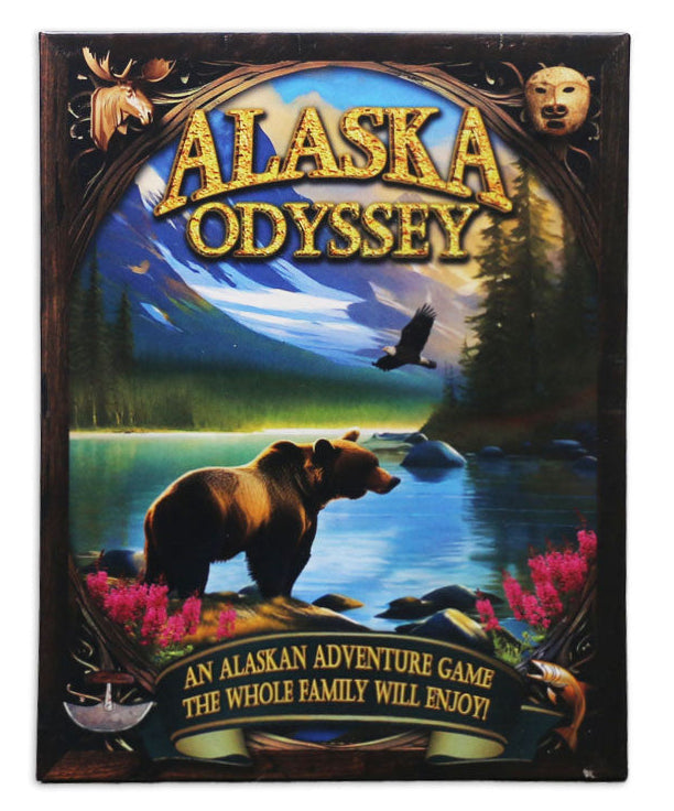 Alaska Odyssey card game box featuring a colorful illustrated cover with a bear by a river, mountains, trees, and the title 'ALASKA ODYSSEY' in large gold letters.